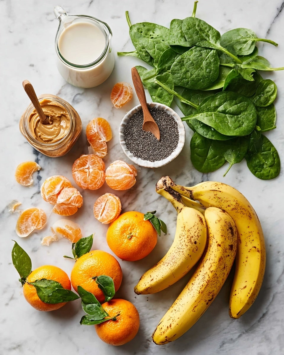 A top view shows a white marbled surface with three ripe bananas with brown spots on the right side, a small white bowl filled with black chia seeds and a small wooden spoon resting in it above the bananas. To the left of the bowl is a cluster of fresh green spinach leaves spread out. Below the spinach are a few clusters of small, round yellow-orange mandarin oranges with green leaves still attached, and some peeled mandarin wedges scattered on the surface. Near the center left is an opened mandarin with segments mostly in place and more loose segments spread nearby. Above the mandarins is a small glass jar filled with light brown nut butter with a wooden spreader resting on top coated in the nut butter. A small clear pitcher of white milk is placed near the upper left corner. photo taken with an iphone --ar 4:5 --v 7