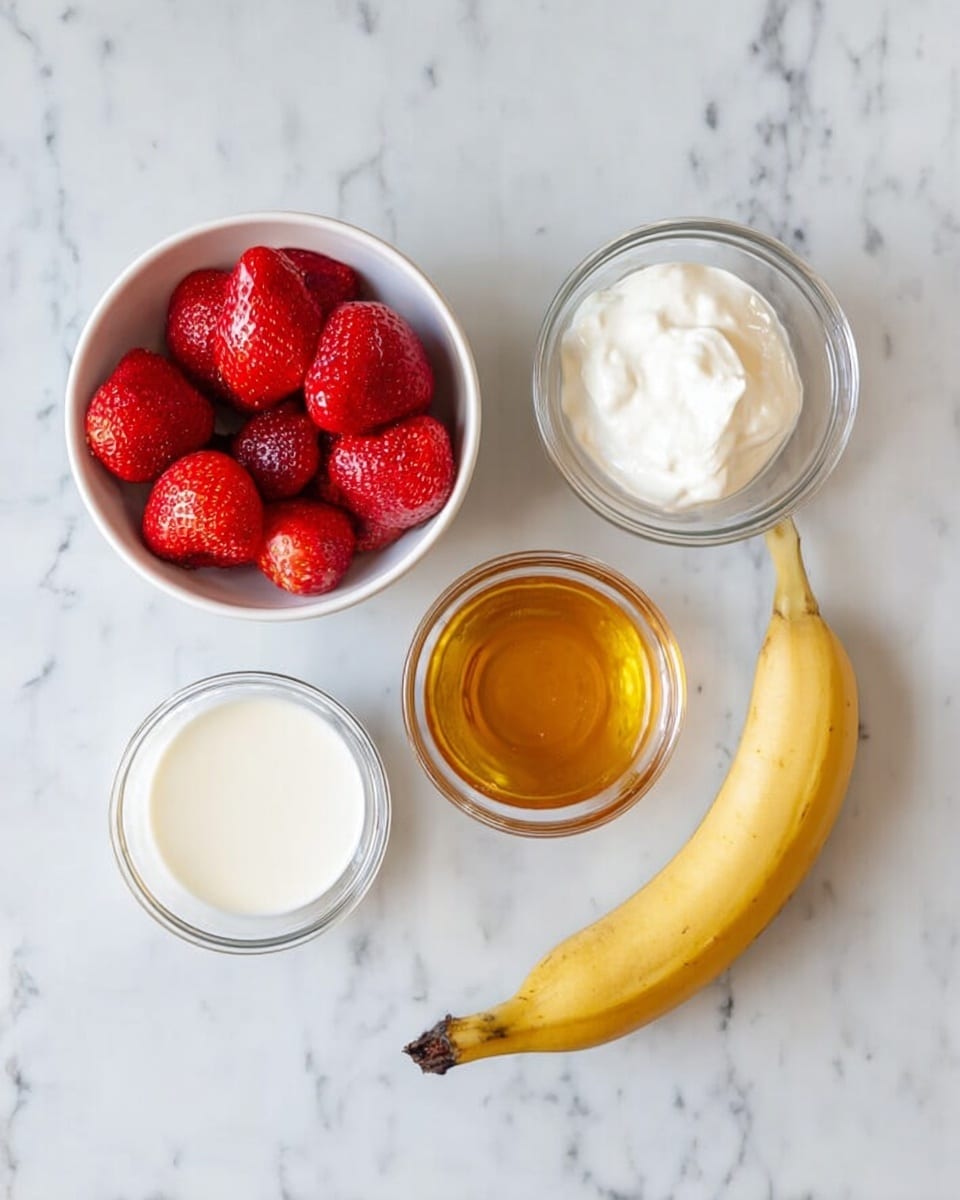 The image shows five ingredients arranged on a white marbled surface: a white bowl filled with whole frozen strawberries in the top left; a small glass bowl with white creamy yogurt in the top right; a smaller glass bowl with golden honey in the center bottom; a small glass bowl containing milk in the bottom left; and a full ripe banana with yellow peel lying to the right side, slightly curved. The items are neatly spaced with soft natural light shining from above photo taken with an iphone --ar 4:5 --v 7