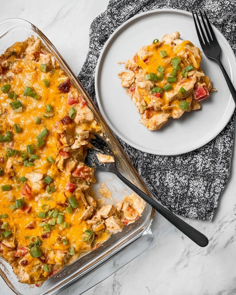 The dish is a thick casserole in a clear glass baking dish showing one main layer of chunky ingredients mixed and covered in melted golden yellow cheese. The cheese has a smooth, creamy texture with small bits of finely chopped green onions sprinkled on top, adding contrast with their fresh green color. Visible within the cheesy layer, there are pieces of softened vegetables and small diced red and green bits blended together. The baking dish is placed on a white marbled surface, next to a wooden spatula and two clean white plates, one on each side. A black and white striped cloth lies partially under the baking dish. photo taken with an iphone --ar 4:5 --v 7