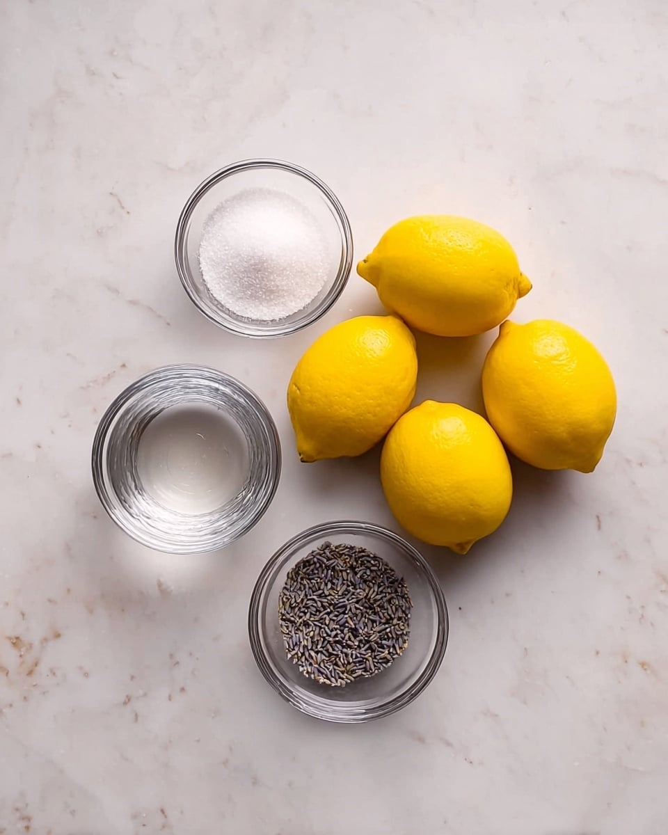 The image shows a top view of ingredients neatly placed on a white marbled surface. There are six bright yellow lemons arranged in a small cluster on the right side. To the left, there are three small clear glass bowls: the top bowl contains white granulated sugar, the middle bowl has purified water, and the bottom bowl holds dried lavender flowers. The setup is simple and clean, with the colors of yellow lemons and the white sugar and water contrasting with the texture of the lavender in the clear bowls. Photo taken with an iphone --ar 4:5 --v 7