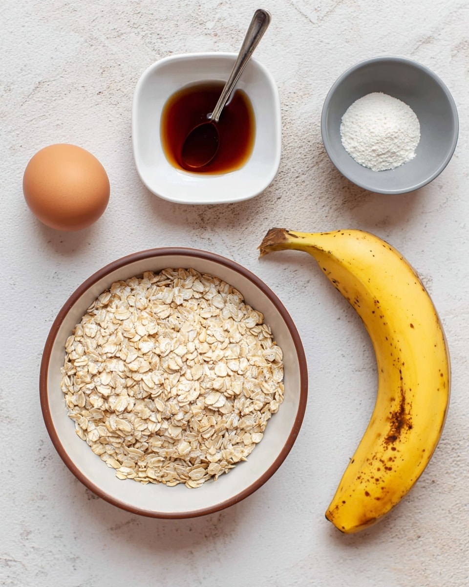 A simple arrangement of five ingredients is spread on a white marbled surface. In the center, there is a shallow round bowl with a brown rim filled with a heap of light beige rolled oats. To the top left is a small white square dish holding dark amber syrup with a silver spoon resting inside. Below that, a single brown egg sits in a small white bowl. To the bottom center is a small round white plate divided into two shades of grey holding a small pile of white powder. To the right, a ripe yellow banana with brown spots lies diagonally, its shape and texture clearly visible. Photo taken with an iphone --ar 4:5 --v 7
