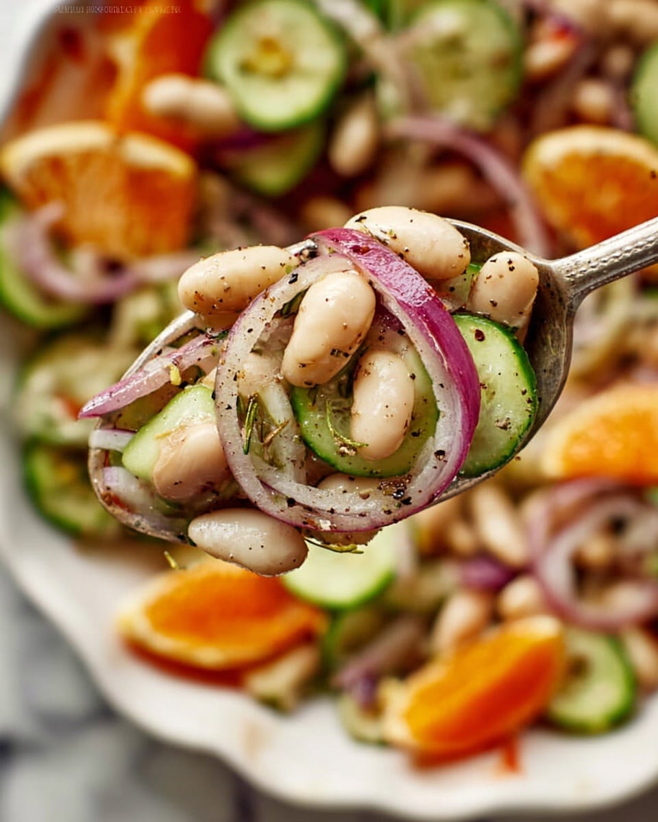 A close-up view of a spoon holding a mix of white beans, thin cucumber slices, purple onion strips, and small herbs, all lightly seasoned with black pepper. The background shows a white marbled surface with a large white bowl filled with more of the same colorful salad, including visible orange slices, cucumber rounds, and onion pieces scattered throughout. The textures are fresh and crisp with varied colors of white, green, purple, and bright orange, creating a vibrant and healthy look. Photo taken with an iphone --ar 4:5 --v 7
