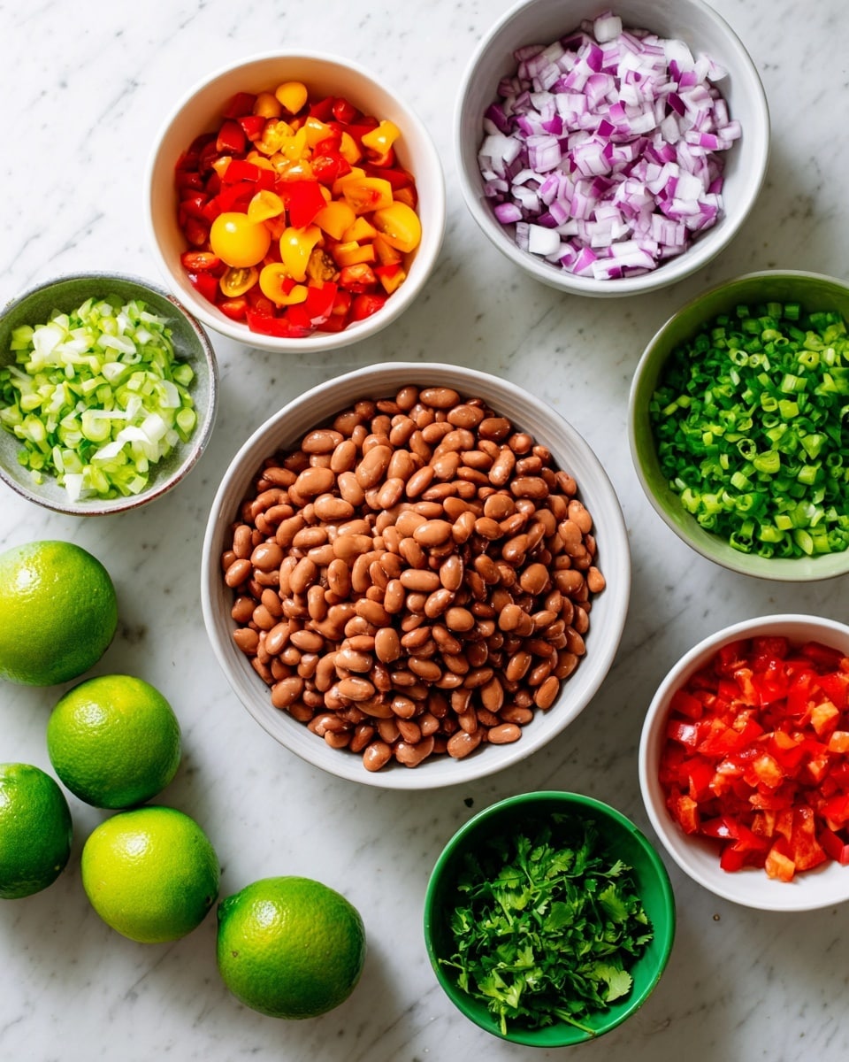 The image shows several bowls and limes arranged on a white marbled surface. In the center, there is one large bowl filled with brown beans that have a smooth texture. Around it, there are six smaller white bowls and one green bowl containing chopped vegetables: one bowl has red diced pieces, another has small mixed cherry tomatoes in red and yellow, one holds finely chopped purple onions, another has chopped green bell pepper, one has chopped green onions, and the last one contains chopped cilantro with a leafy texture. Three whole green limes are placed near the bottom left side. The bowls and items are neatly arranged with vivid natural colors. photo taken with an iphone --ar 4:5 --v 7