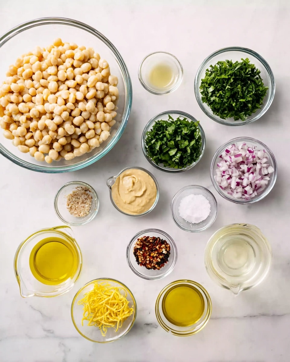 The image shows 11 clear glass bowls arranged on a white marbled surface. In the center left is a large bowl filled with pale yellow cooked chickpeas with a bumpy texture. To its top right, three small medium clear bowls hold fresh chopped green herbs with leafy texture. Another small bowl to the right has finely chopped light purple shallots. Below these, another small bowl contains a smooth pale yellow mustard-like paste. Two small measuring cups filled with light yellow oil and a clear, slightly yellow lemon juice are placed at the bottom right. Two small bowls near the bottom hold fine white salt and a mix of red and black chili flakes. A very small bowl to the bottom left is filled with bright yellow lemon zest strands. Everything is evenly spaced on the smooth white marbled surface, making the colors of ingredients stand out clearly. photo taken with an iphone --ar 4:5 --v 7