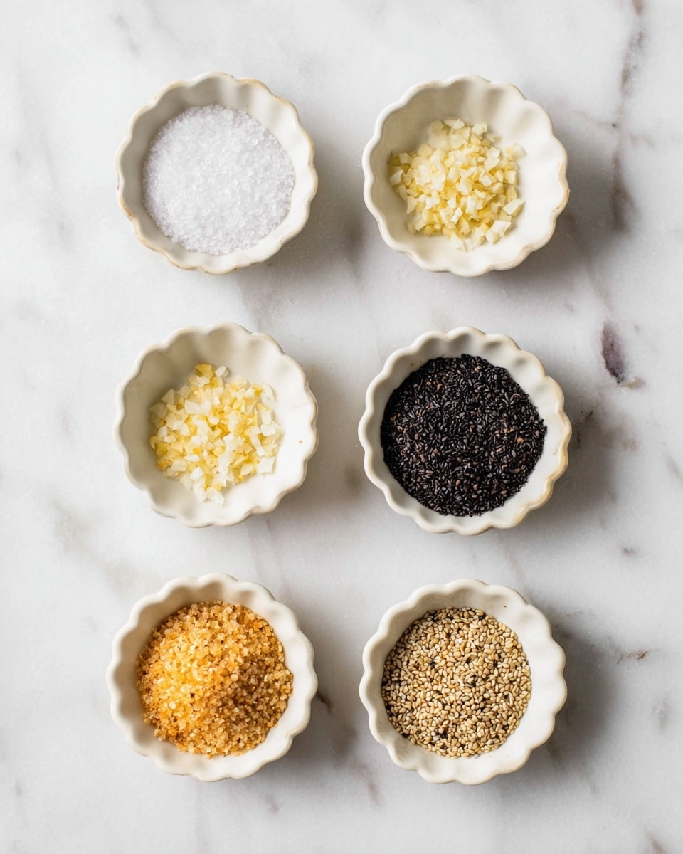 The image shows six small white scalloped bowls placed on a white marbled surface, arranged in two vertical columns of three bowls each. The top left bowl contains coarse white salt, the middle left bowl holds finely chopped garlic pieces that are pale yellow, and the bottom left bowl contains small dark brown seeds. The top right bowl is filled with crushed pale orange flakes, the middle right bowl has small black seeds with a rough texture, and the bottom right bowl holds light brown sesame seeds. The bowls are evenly spaced and the colors of the contents contrast clearly against the bowls and surface. photo taken with an iphone --ar 4:5 --v 7
