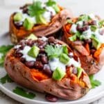 Black Bean Stuffed Sweet Potatoes with Cashew Cream and Fresh Toppings Recipe