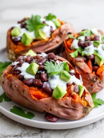 Black Bean Stuffed Sweet Potatoes with Cashew Cream and Fresh Toppings Recipe